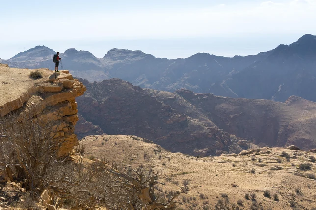 Hikers trekking through Dana Biosphere Reserve toward Petra